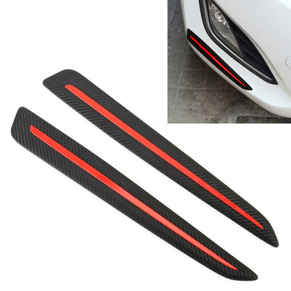 Pair of black carbon-fiber bumper guard strips with red accent lines