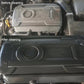 Car engine bay with cleaned engine cover surface, dust reduced after washing