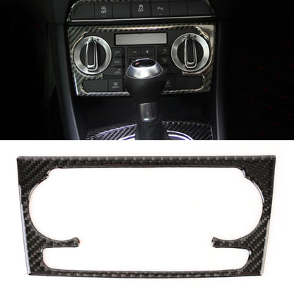 Carbon fiber AC switch panel sticker in dashboard console, with cutouts for knobs