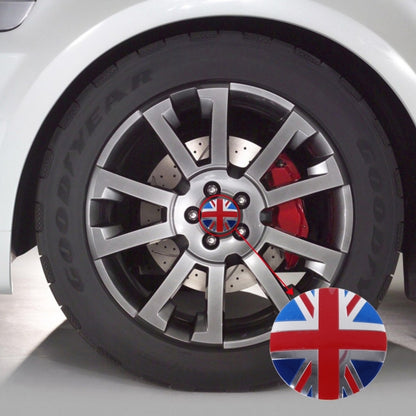 Car wheel center cover sticker with Union Jack design on a silver alloy wheel.