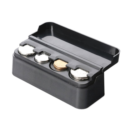 Black coin holder with hinged lid and molded slots for several coins