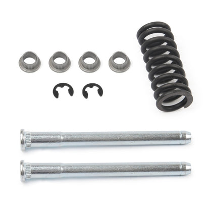Door hinge bushing kit with black coil spring, four metal bushings, two retaining clips