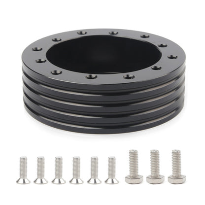 Black steering wheel spacer hub with top bolt holes and included mounting screws