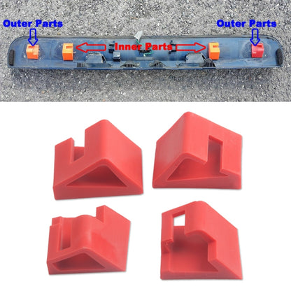 Red plastic tailgate repair clips, shown attached to trim bar slots