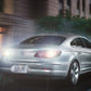 Car front lights with bright white LED glow and amber turn signal illumination