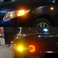 Car turn and parking lights glowing amber with bright LED circular segments