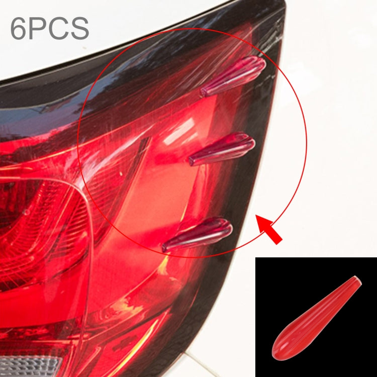 Red translucent resin car spoiler strips set, close-up with arrow