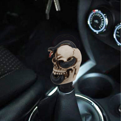 Resin skull car gear shift knob with black snake-like detail, black textured base