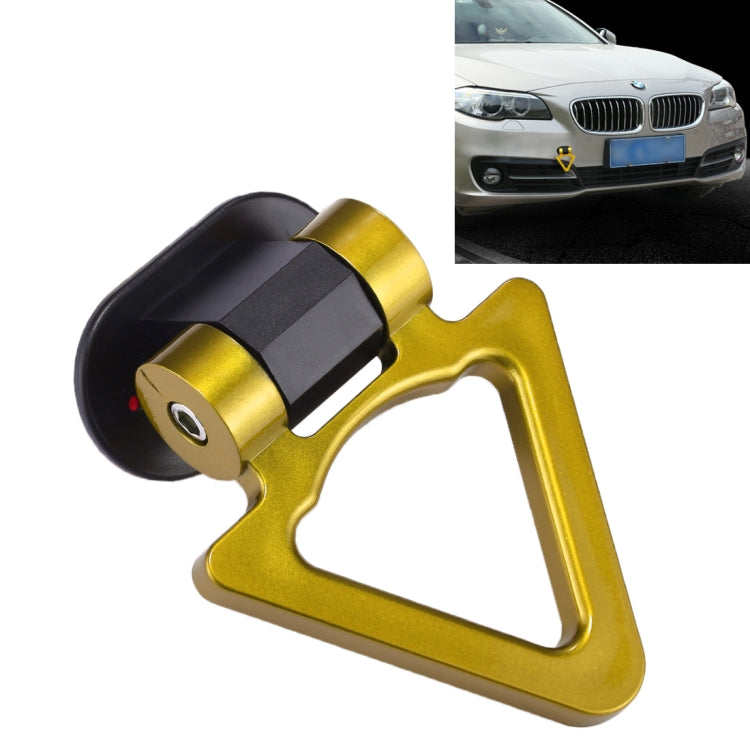 Gold car tow hook with black mounting base and triangular opening for bumper