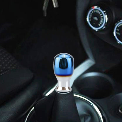 Blue aluminum gear shifter knob adapter with silver collar, shown on car center console