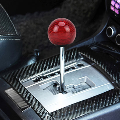 Red carbon-fiber ball gear shift knob with textured pattern and chrome base