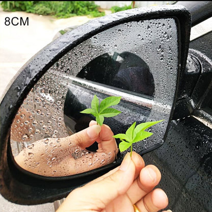 Clear anti-fog waterproof film applied to a car rearview mirror with water droplets