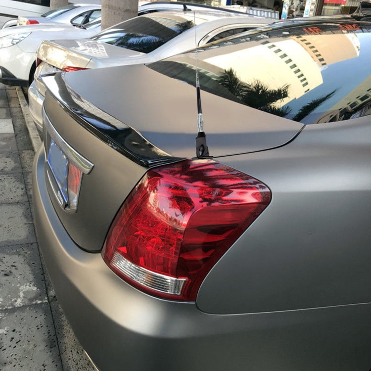 Glass-mount cellular antenna installed on car rear tail light area
