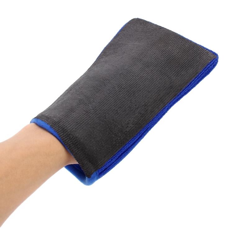 Car washer glove on hand, dark gray outer cloth with blue wrist trim