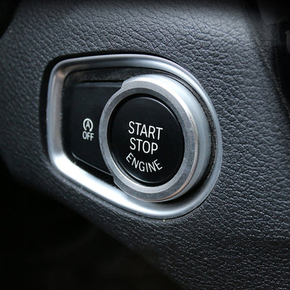 Car engine start push-button ring trim with silver bezel around Start/Stop Engine button