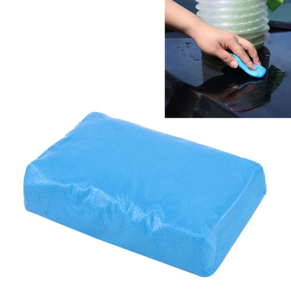 Blue car detailing clay bar for removing grime from vehicle paint