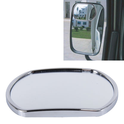 Truck blind spot mirror with chrome oval frame, mounted on vehicle door