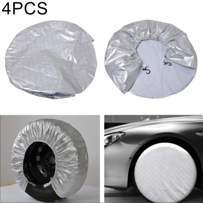 Silver round wheel tire covers with elastic loop openings, set of multiple pieces.