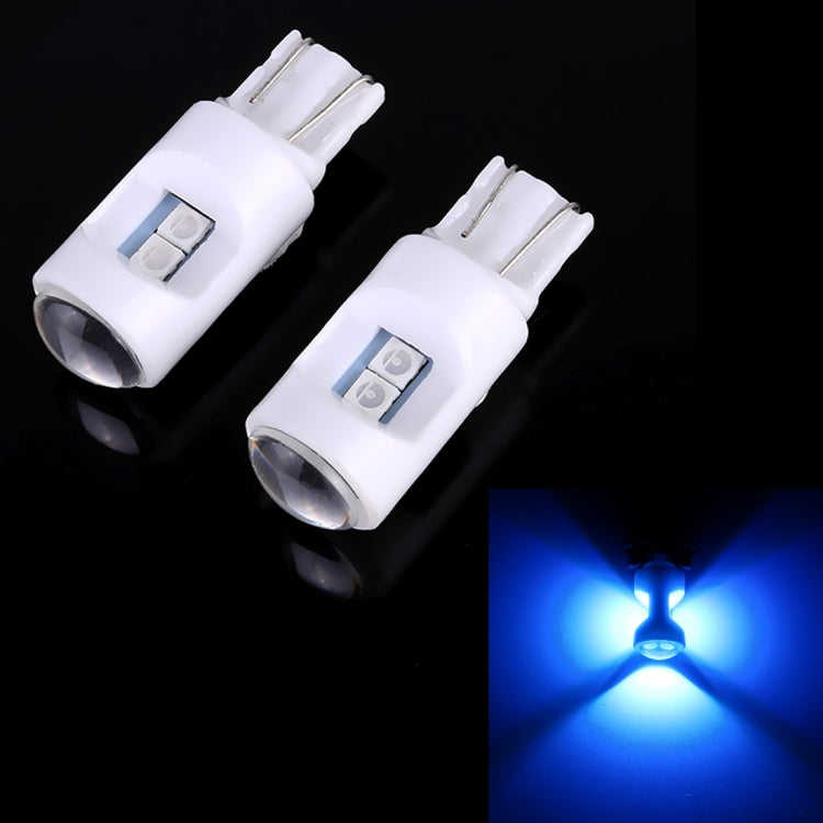 Pair of white T10 LED projector bulbs emitting blue light