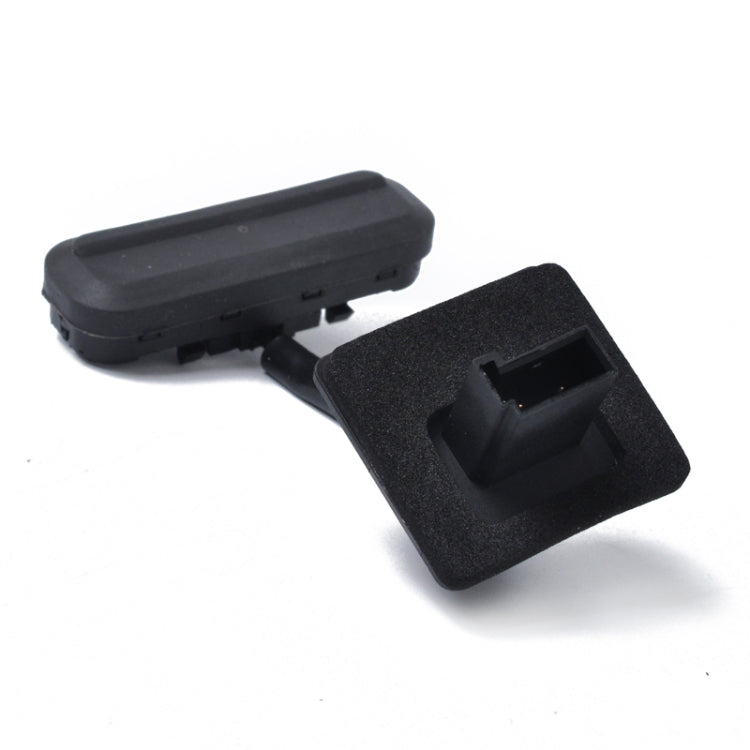 Black tailgate release button switch set with textured mounting panel