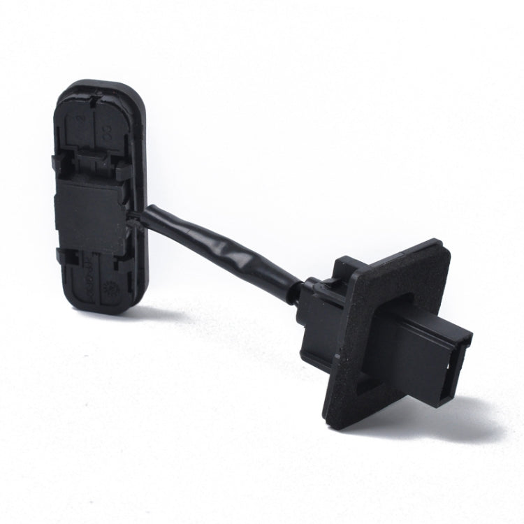 Black trunk release button switch with attached wiring harness