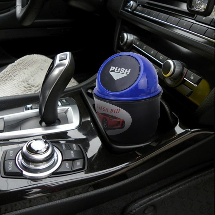 Blue car trash bin in car center console with push-top lid