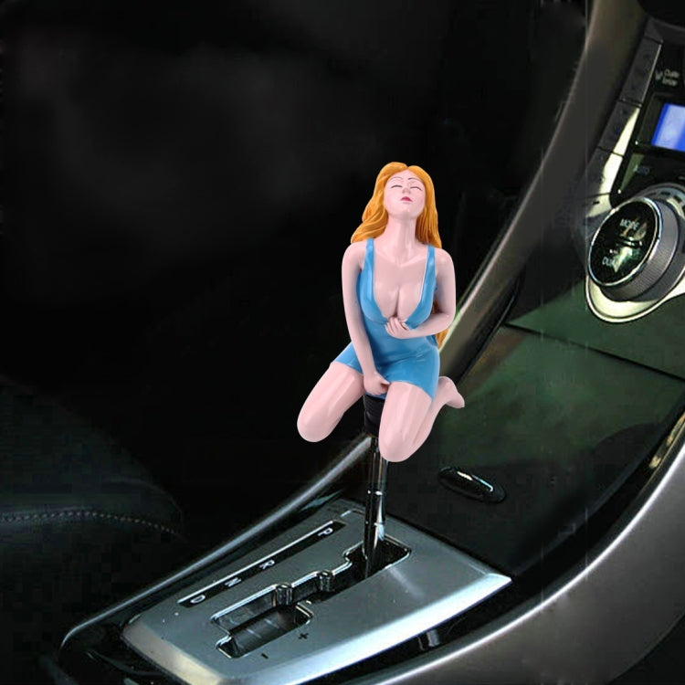 Car shift knob topper with blonde woman figure in blue outfit on gear area