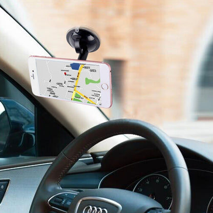 Black cupula phone holder with suction mount on car dashboard