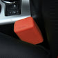 Orange rubber car seat belt buckle lock cover on car seat