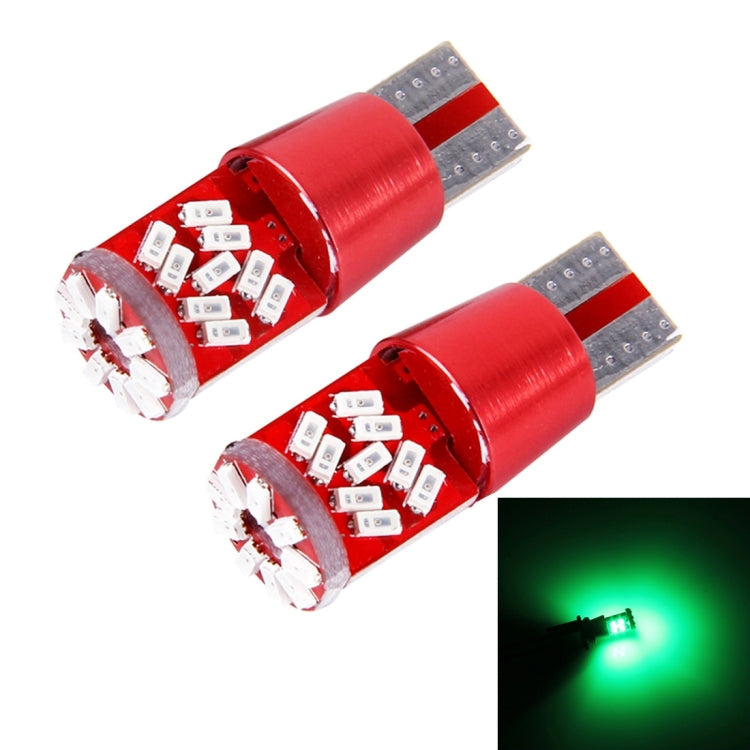 Pair of T10 LED bulbs with green light glow in front inset