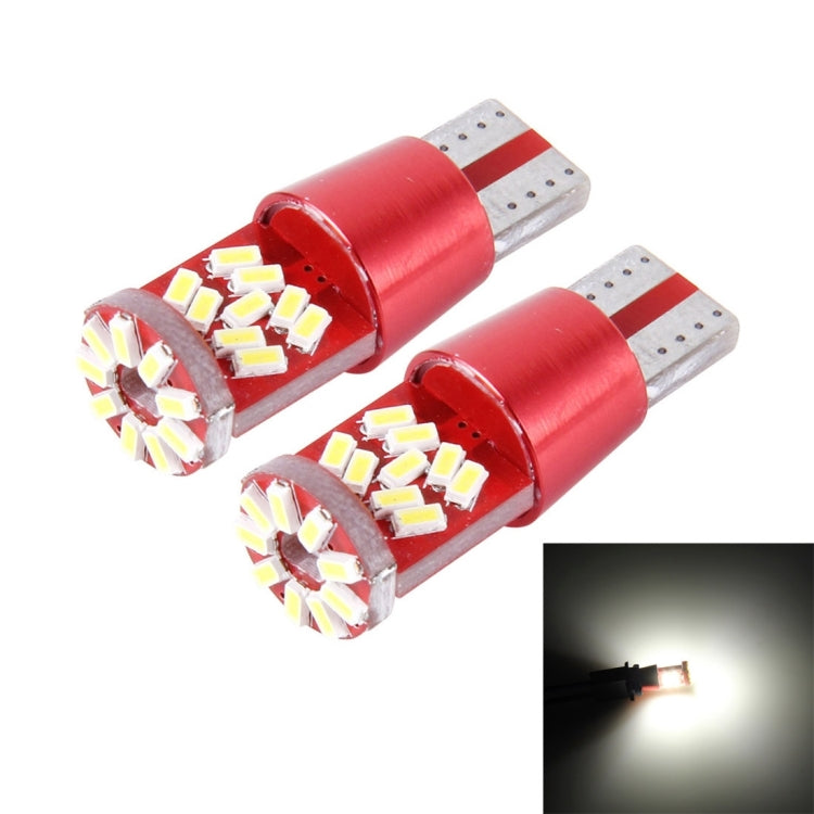 Pair of T10 LED bulbs with bright white light glow in front inset