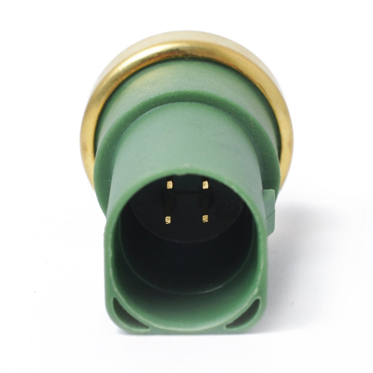 Coolant temperature sensor electrical connector with green housing and gold rim, pin view