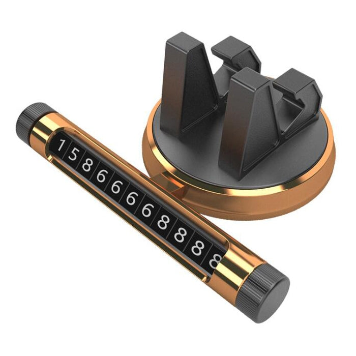 Gold car dashboard temporary parking number card holder with black privacy cover and digits.