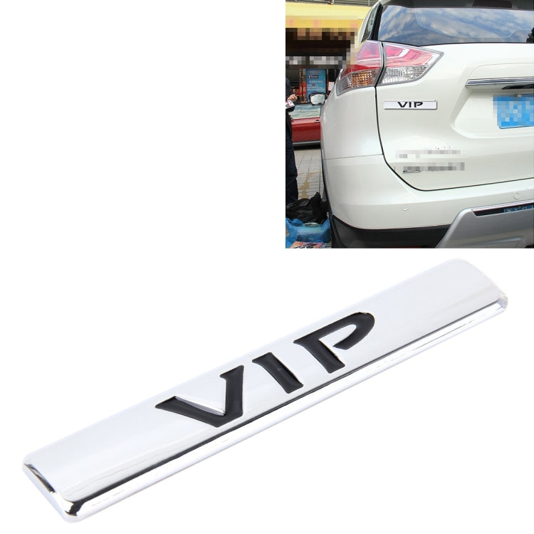 Silver VIP 3D metal car sticker with raised VIP letters, close-up