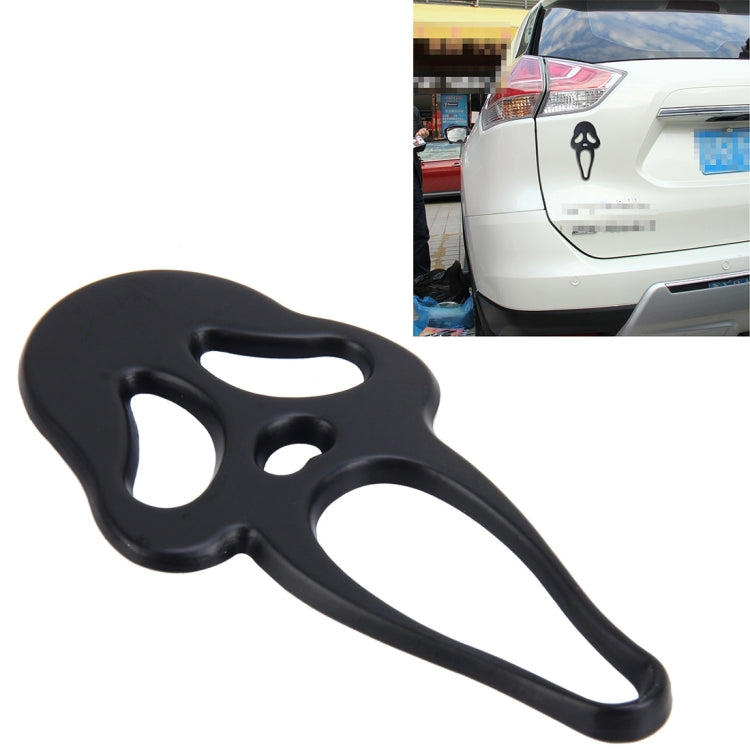 Black elf-shaped metal car sticker with face cutout design