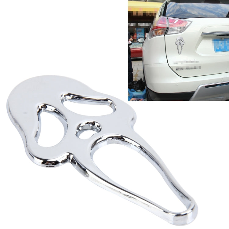 Silver elf-shaped metal car sticker with face cutouts