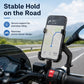 Black phone holder mounted on motorcycle rear-view mirror with cradle grips