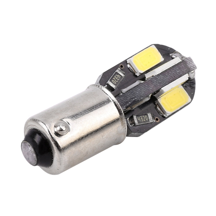 BA9S LED bulb close-up, silver base with two yellow SMD chips in black holder