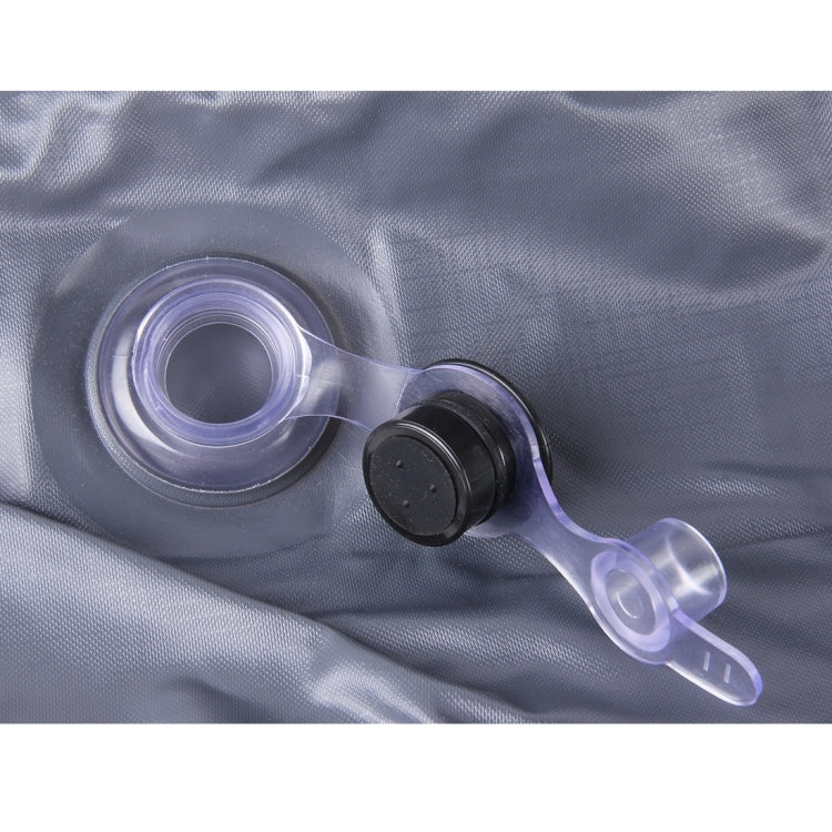 Inflation valve with nozzle on gray-blue inflatable mattress fabric surface