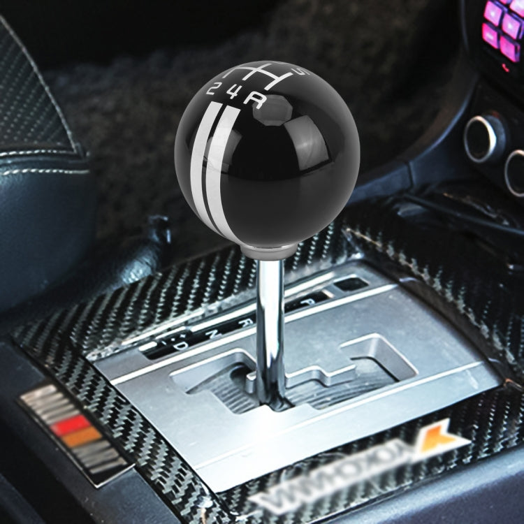 Black resin gear shift knob with silver stripe bands and 5-speed number markings