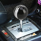 Black ball-style gear shift knob with white stripe and 246 marking