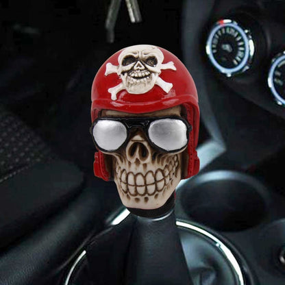 Skull-shaped gear shift knob cover, red helmet with white skull and silver goggles