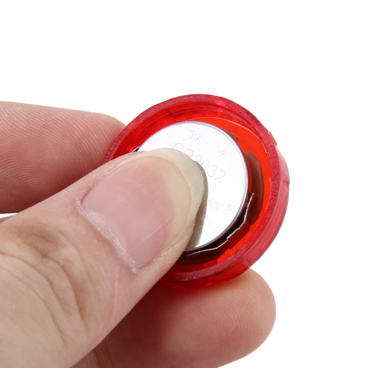 Car door anti-collision warning strobe light close-up, red lens with circular rim
