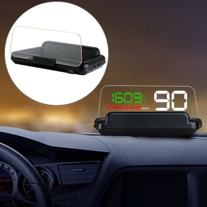Car HUD OBD2 display unit with green speed reading and reflective board on dashboard