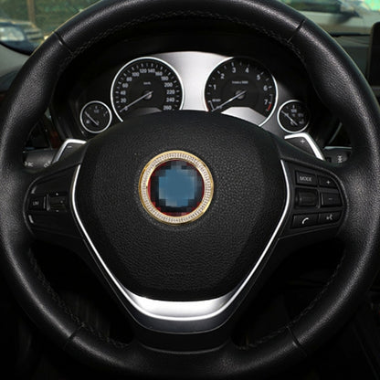 Gold diamond steering wheel center decoration ring on a black steering wheel