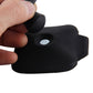 Black magnetic rear view mirror held in hand, showing circular mounting area
