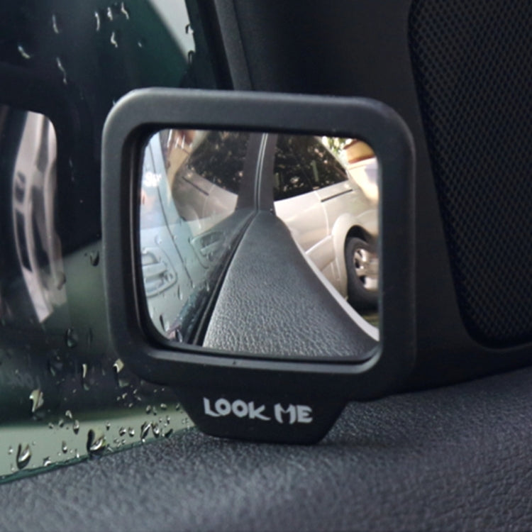 Black wide-angle rear view mirror mounted on car seat with LOOK ME logo