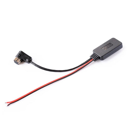 Car Bluetooth AUX adapter module with black housing and red/black wire leads