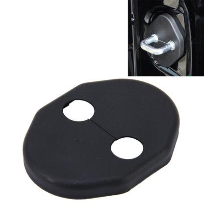 Black car door lock cover with two circular holes and a V-shaped cutout