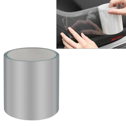 Clear car door edge protection tape film being applied to a vehicle door